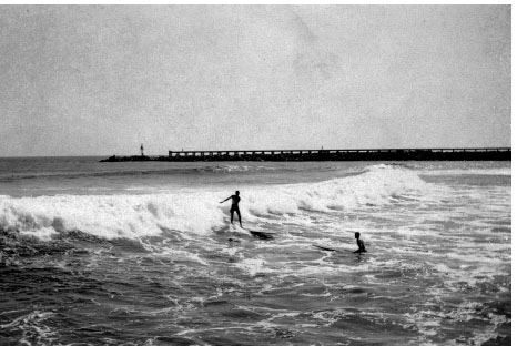 Surfing the Newport Harbor channel in the 1930s The surf changed as the bay - photo 2