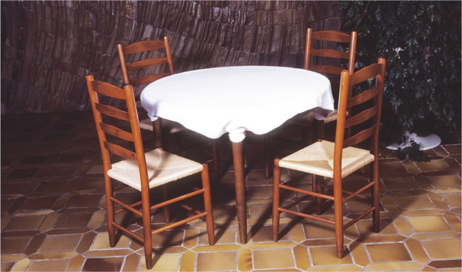 Table covered in a thick material cotton to prevent the tablecloths from - photo 15