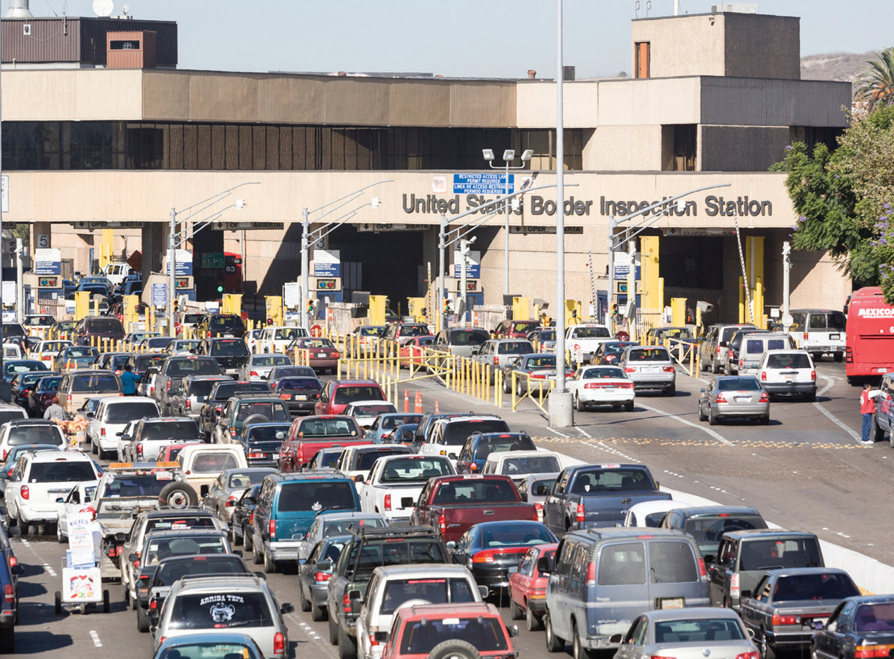 People sometimes wait for hours to cross the border from Mexico into - photo 5