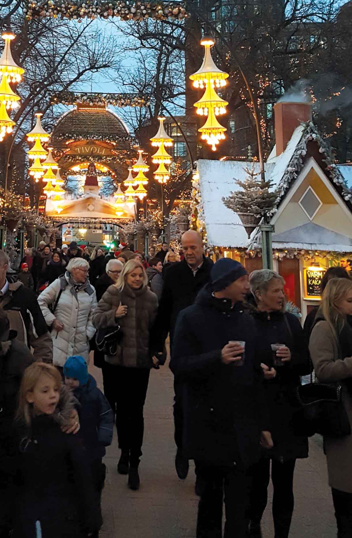 Shoppers enjoying a stroll through Tivoli Gardens Copenhagen The author - photo 10