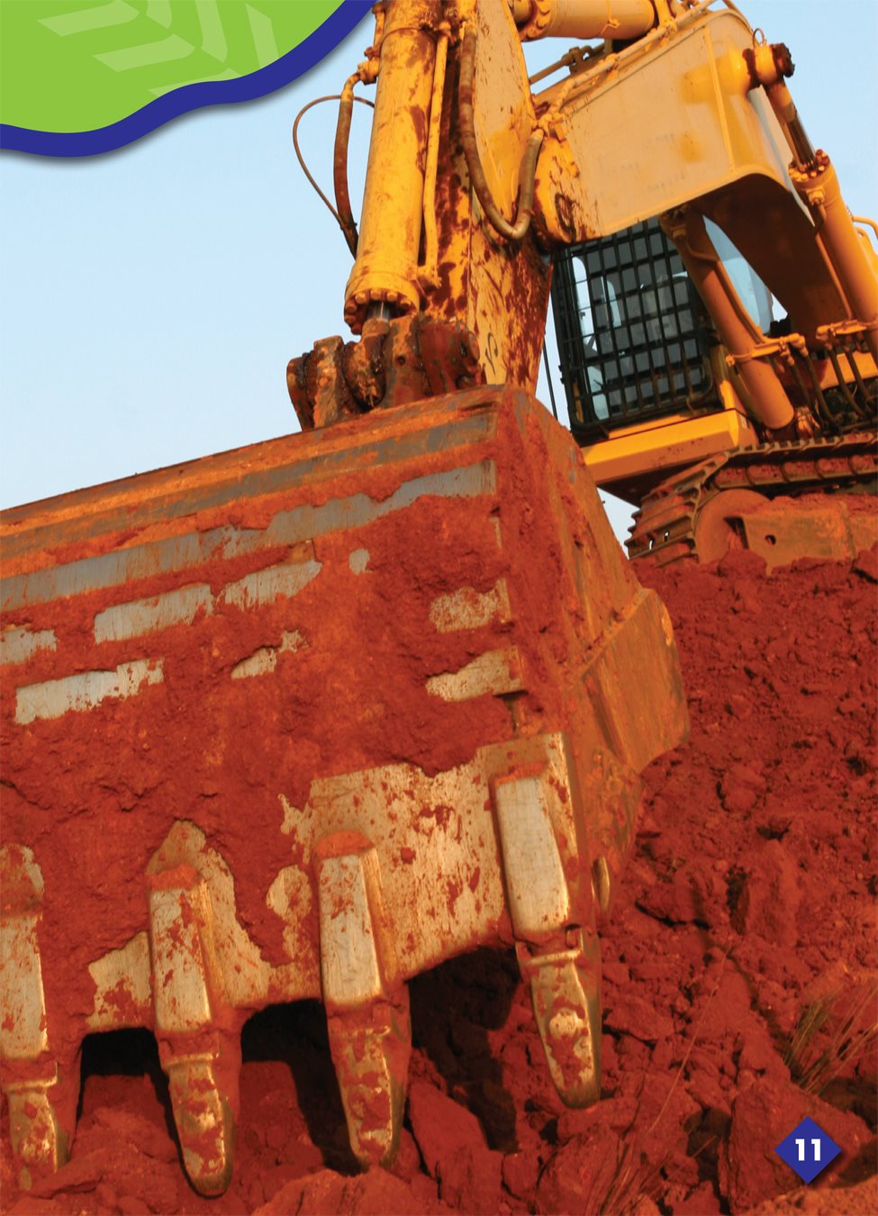 This backhoe drops the dirt and rocks into a dump truck - photo 15