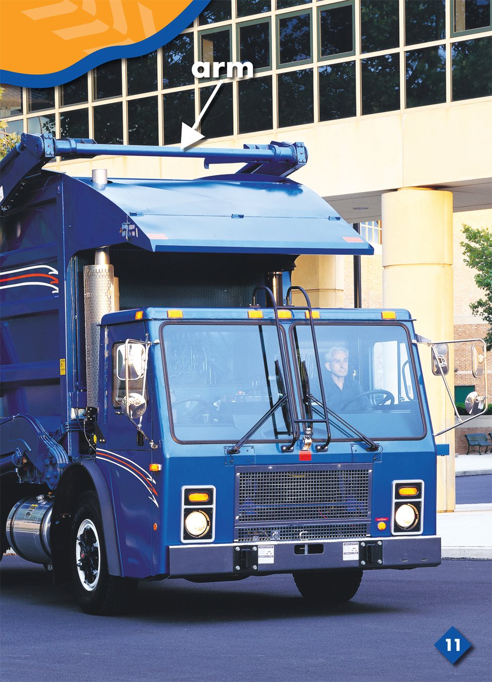 The arm lifts a metal bin a large metal box that holds trash over the cab - photo 16