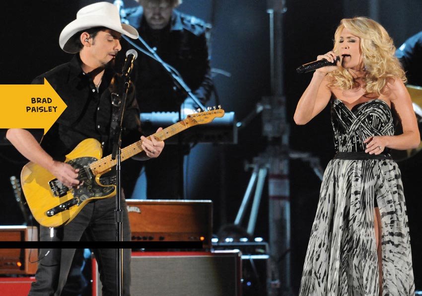 BRAD AND CARRIE PERFORM DURING THE 45TH ANNUAL CMA AWARDS At first Carrie - photo 9