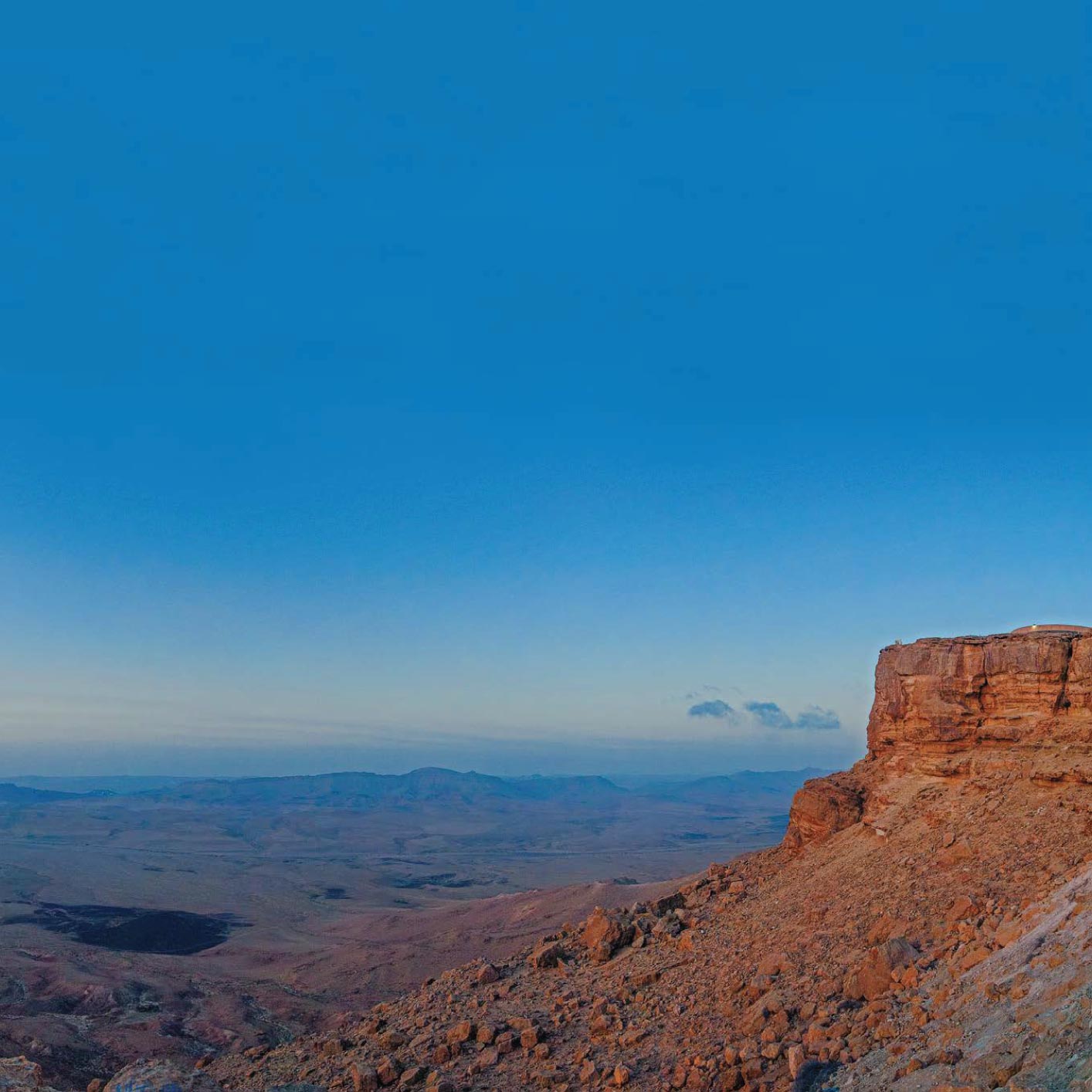 The setting sun turns the canyon red and purple A thin curve of moon hangs - photo 15