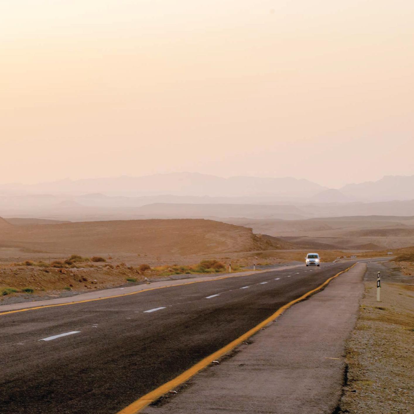 My family drives along the steep desert road that leads to the Machtesh Ramon - photo 6