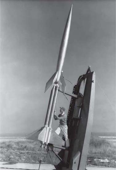 A NASA technician measures a RM-10 model booster 1951 1 Secularisation - photo 2