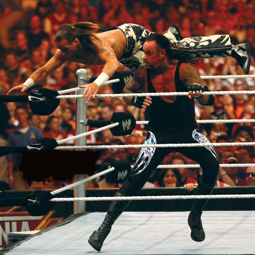 WWE superstar Shawn Michaels battles the Undertaker standin g during the - photo 6