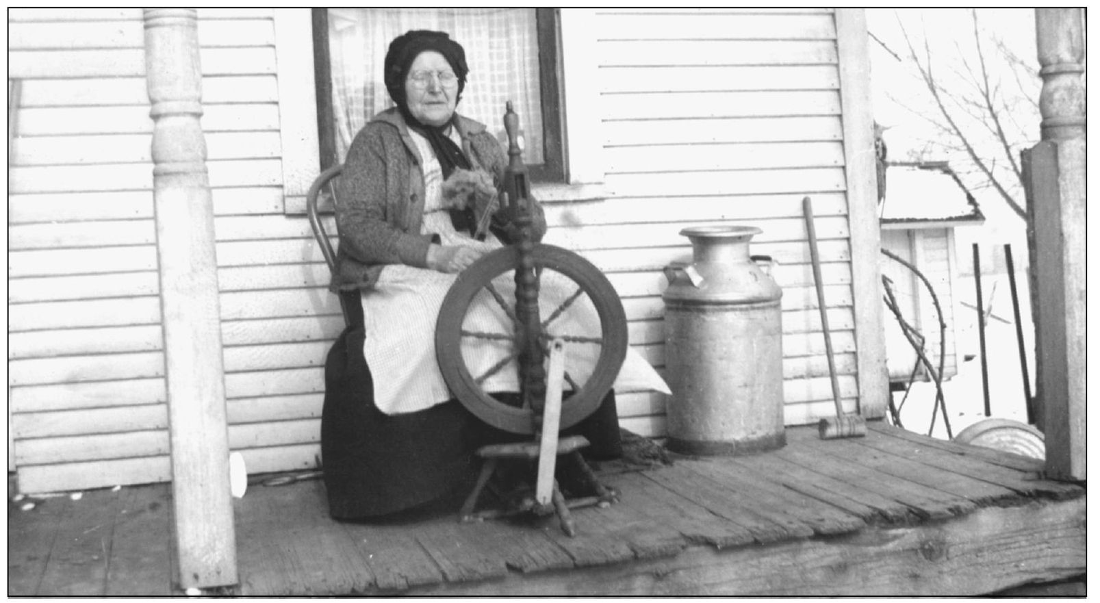 Annie Smith sits spinning yarn out of sheeps wool She lived on this farm for - photo 10