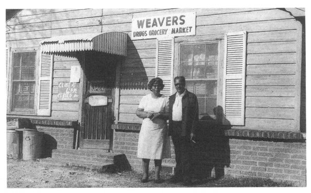 Arthur Weaver and his wife pictured in front of their grocery store on Butt - photo 10