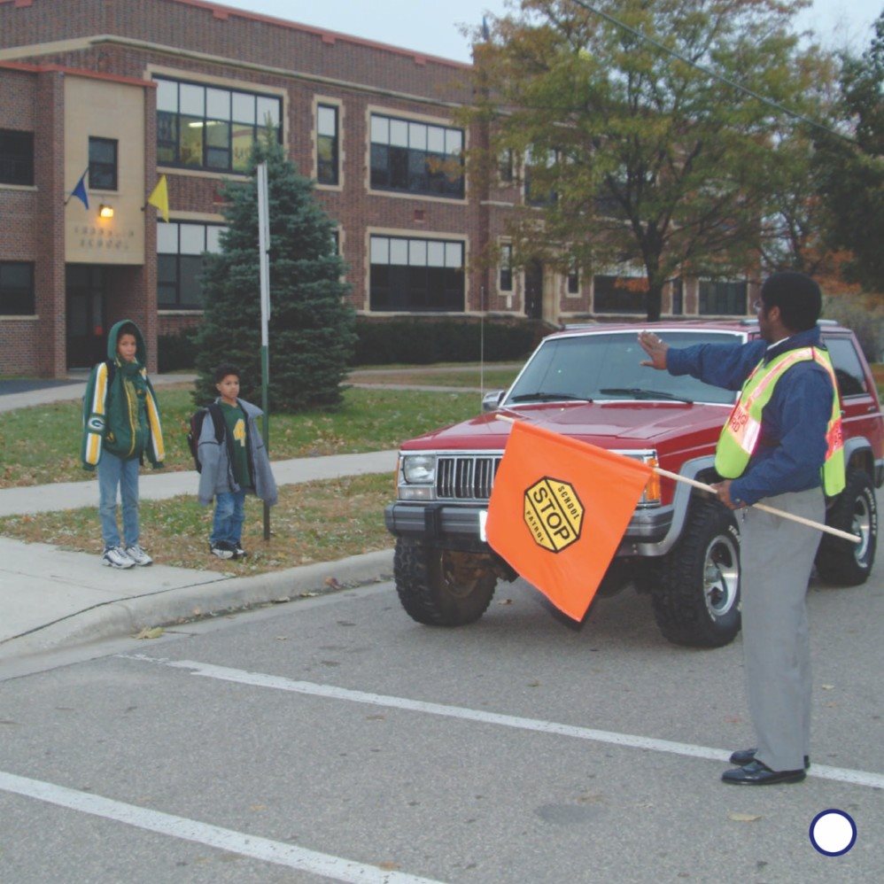 A crossing guard may hold up a stop sign or a flag Stop signs and flags - photo 7