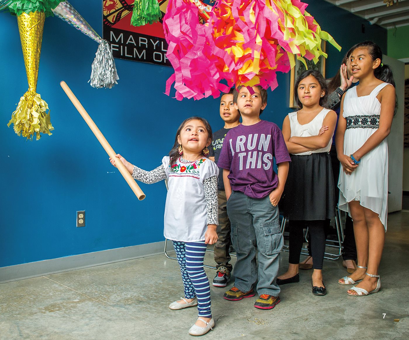 A girl in the United States bobs for apples at her birthday party - photo 11