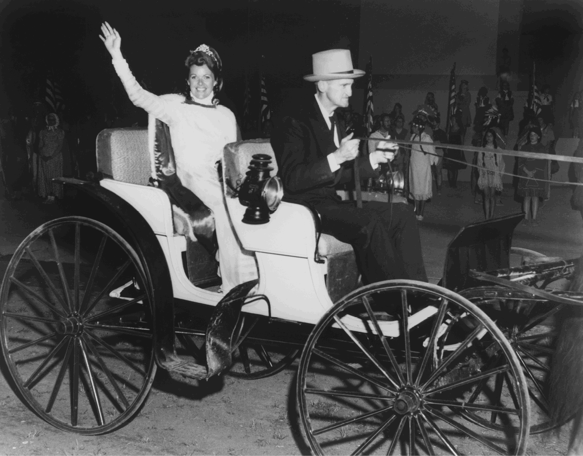 Centennial Queen Sally Hagen waves graciously to the large audience at the - photo 4