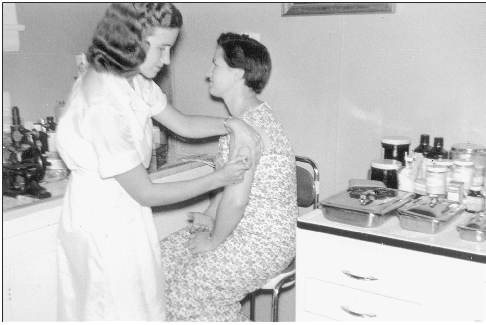 Registered nurse Marie Haynes Ashworth gives a shot to a patient in the office - photo 9