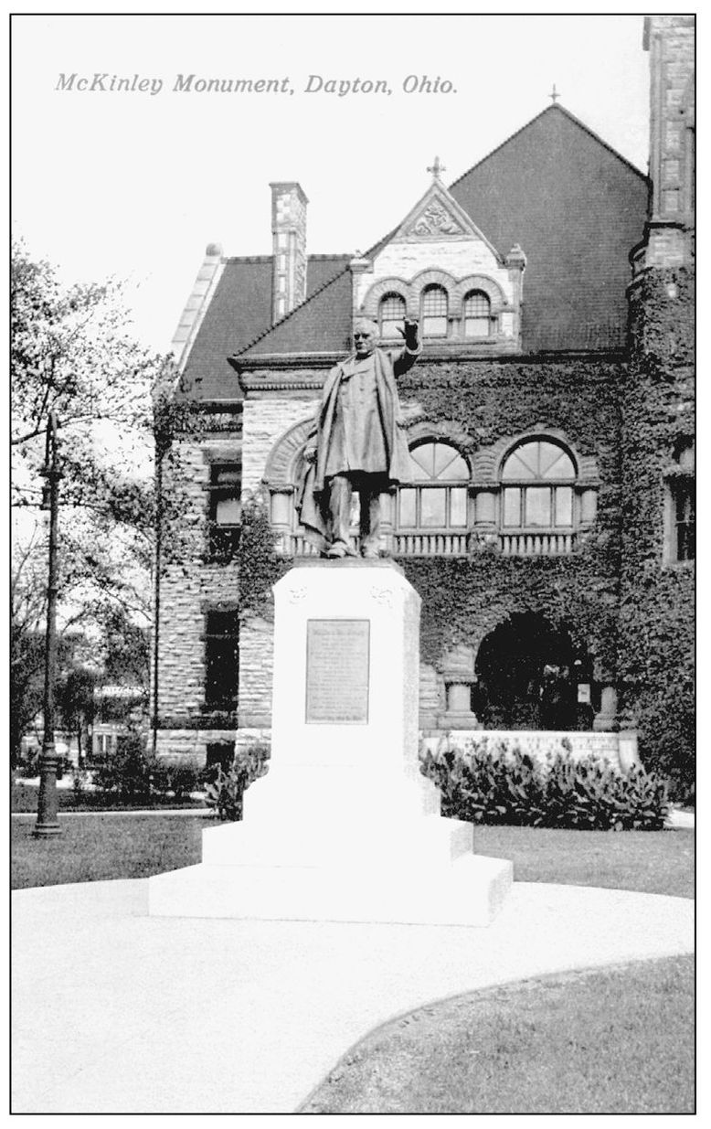 This monument shows Pres William McKinley in a suit and long overcoat Located - photo 7