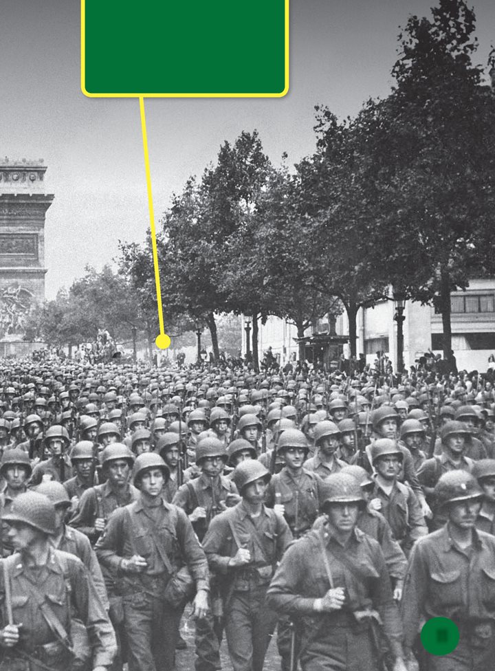 US soldiers march through Paris France during World War II A - photo 12