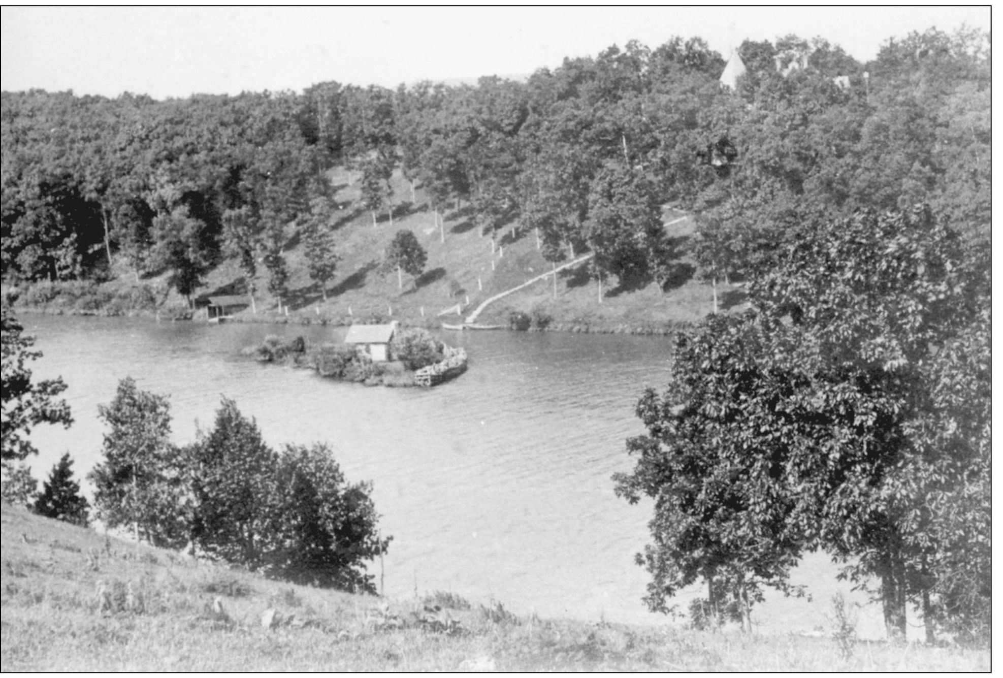 Shown in the middle of this photograph is a small cabin that was built on a - photo 4