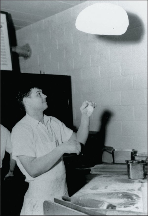 Tom Monaghan tosses dough in the early 1960s The name of the business was - photo 8