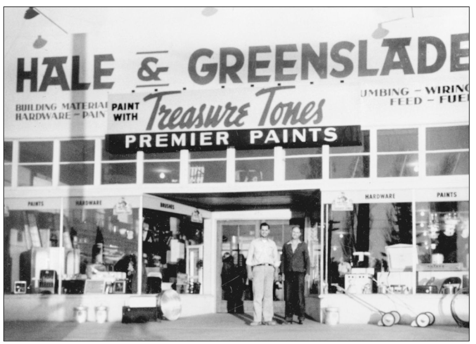 Elwain Hale left and Gordon Greenslade stand in front of their business on - photo 12