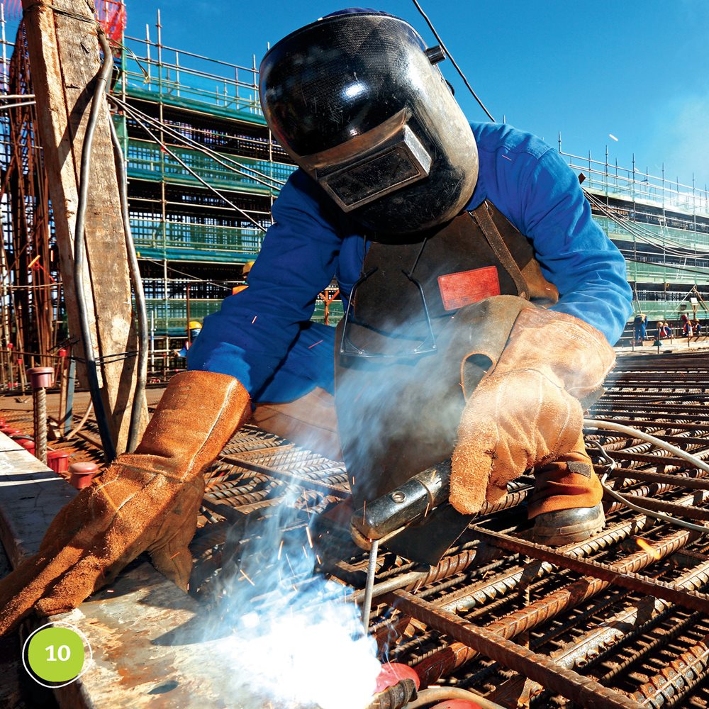 Other workers build with metal They weld steel Steel holds up tall - photo 10