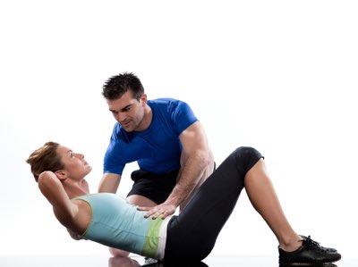 A coach helping an athlete do sit-ups stretch stretching A type of exercise - photo 9