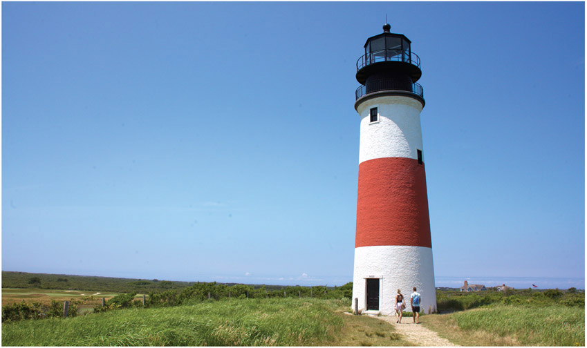 A couple strolls down the sandy path to iconic Sankaty Head Light This - photo 4