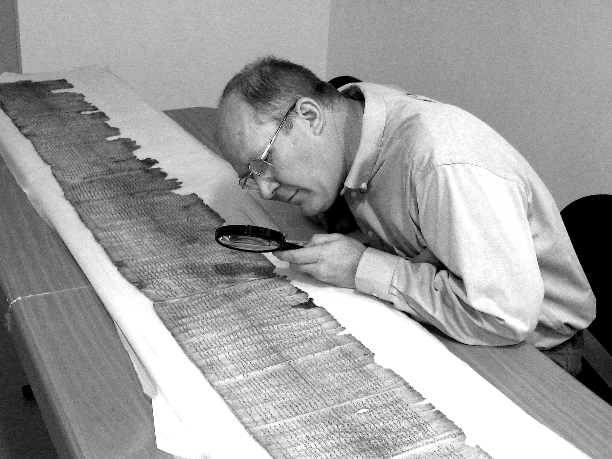 Donald W Parry studies the Great Isaiah Scroll in the museum vault of the - photo 3