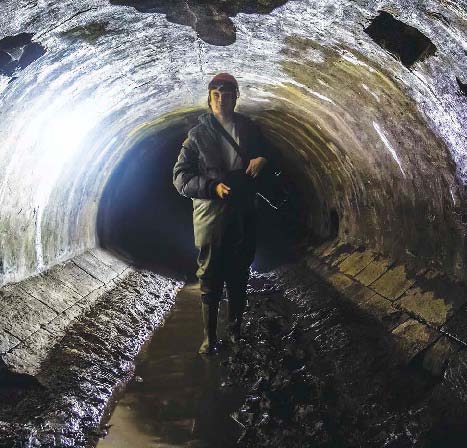 One part of a sewage workers job is to inspect sewers Some sewers in older - photo 6