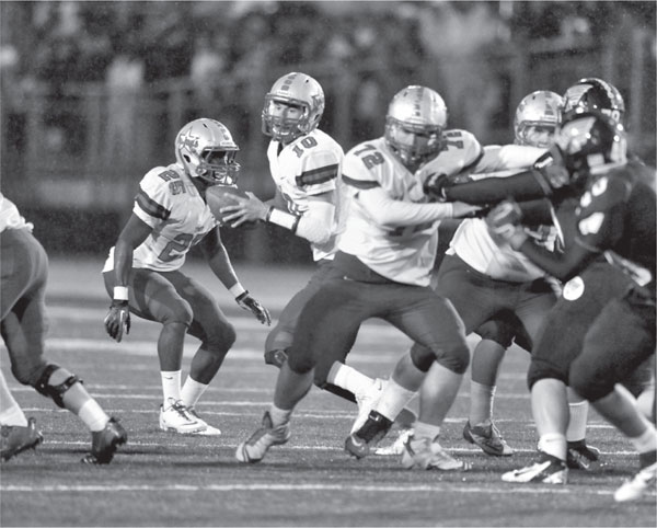 Troy quarterback Matt Barr looks for an open receiver during the 2014 meeting - photo 5