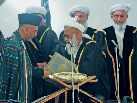 On December 7 2004 newly elected Afghan president Hamid Karzai left shakes - photo 2