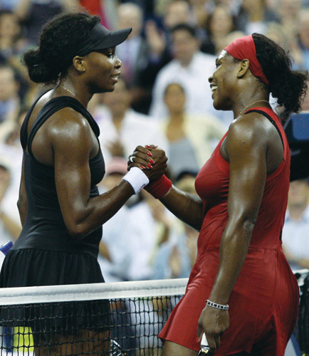 Serena Williams right shakes hands with her sister Venus Williams after - photo 3