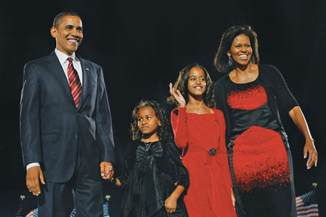 President-elect Barack Obama acknowledges his supporters along with his wife - photo 4