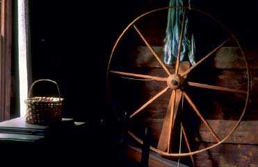 Spinning wheel in the log farmhouse at the Mountain Farm Museum Copyright 2011 - photo 2