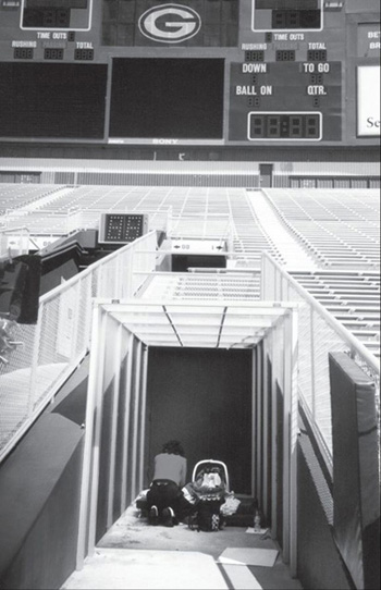 Jessie changing a diaper in the Packers tunnel CONTENTS MY LIFE WITH THE GREEN - photo 2