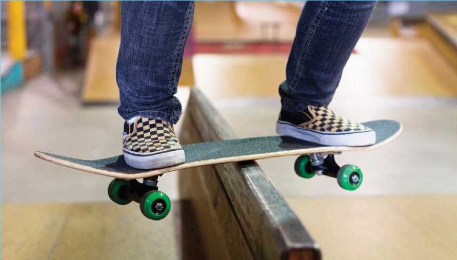 A skater slides her board along the top of a rail one of the typical - photo 4