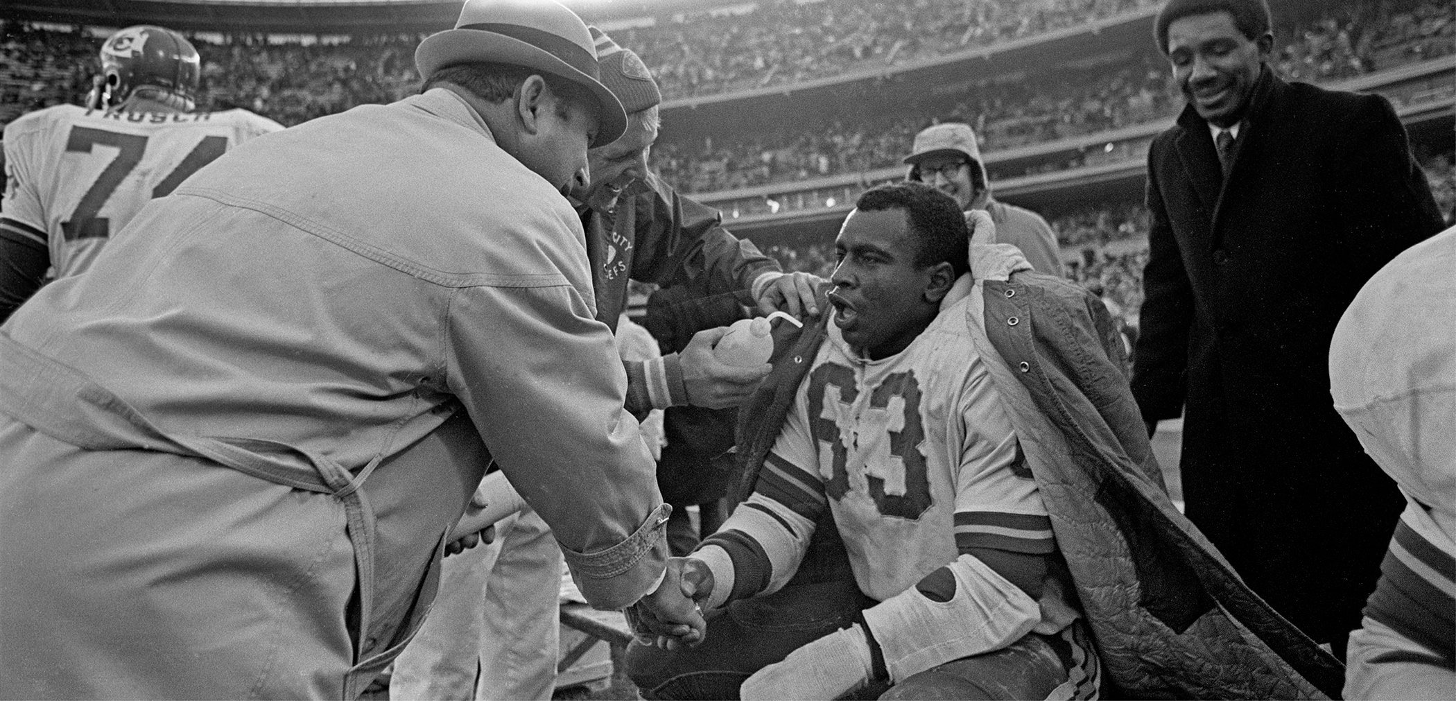 Hank Stram congratulates Willie Lanier after his forty-four-yard interception - photo 3