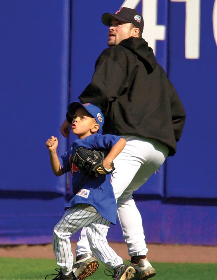 New York Mets pitcher Mike Hampton and Patrick Mahomes II both try and catch a - photo 5