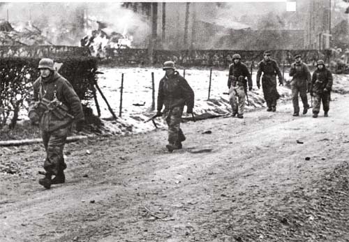 SS panzergrenadiers in an Ardennes village A barn is burning possibly - photo 9