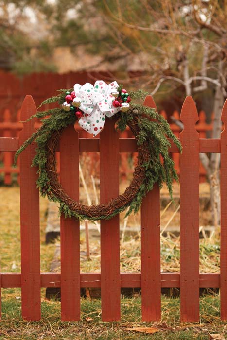 This grapevine wreath is in its simplest form highlighted by a few evergreens - photo 9