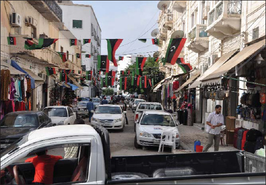 Libyans celebrate the fall of longtime ruler Muammar Gadhafi by displaying the - photo 6