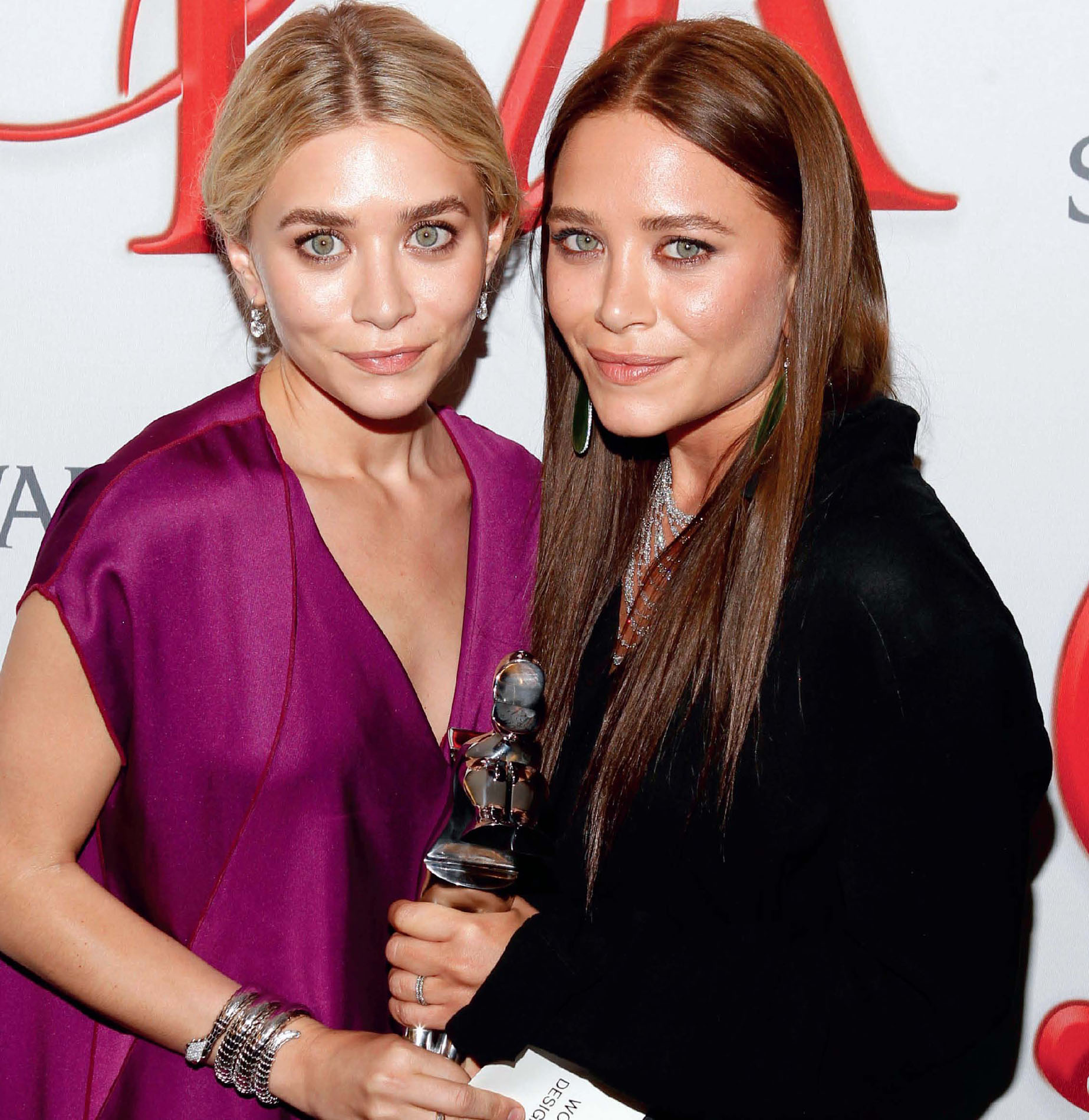 Ashley left and Mary-Kate Olsen have won several fashion awards for their - photo 7