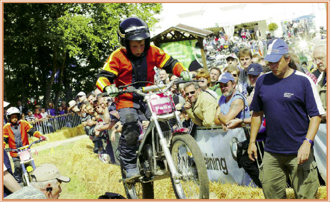 A young racer works the course Riders line up at the starting line One of - photo 1