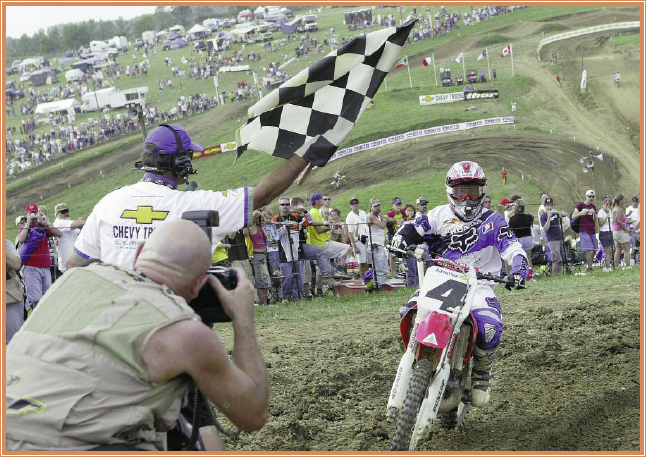 The checkered flag marks the finish line of a motocross race A motocross - photo 12