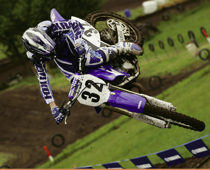 A motocross rider gets big air as he works his way around the course - photo 13