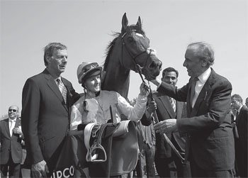 and in the Newmarket winners enclosure with Sir Henry Cecil and owner Khalid - photo 7