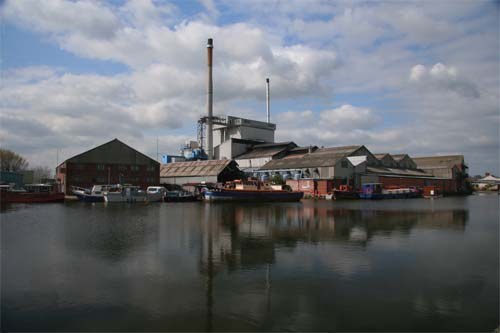 Factories reflected in the water of the Aire and Calder Navigation at - photo 1