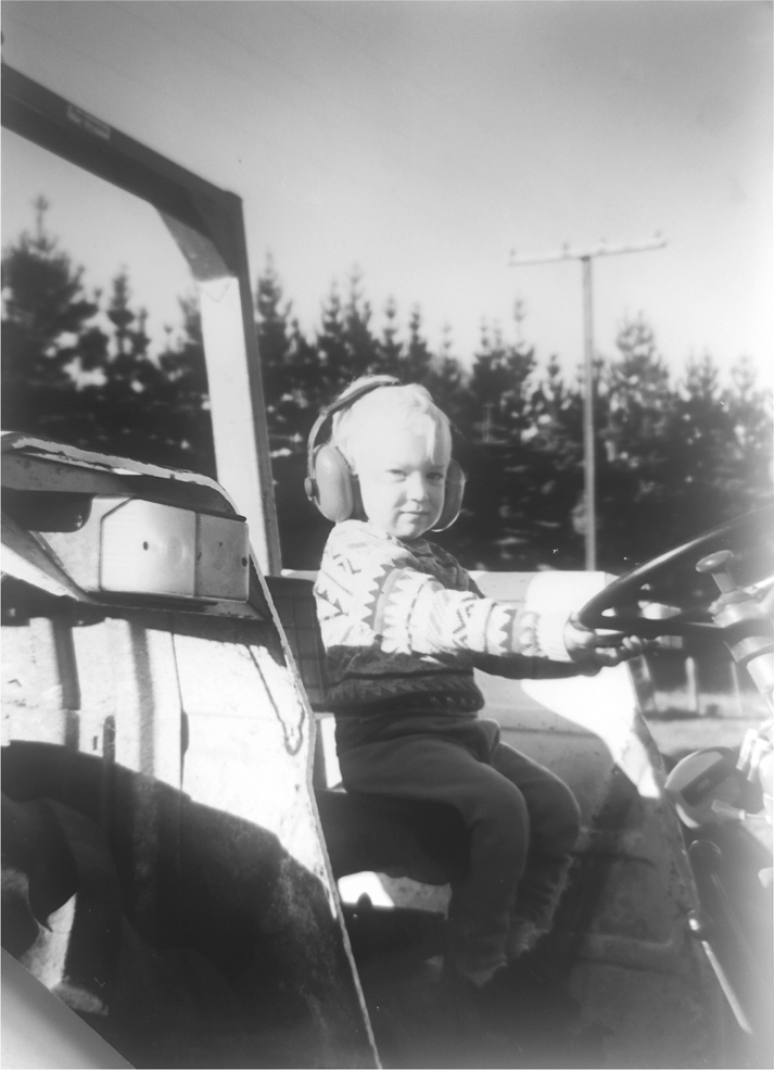 As a four-year old on my favourite farm vehicle Uncle Ians Ford Tractor - photo 2