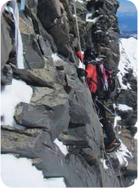 A sick and weakened Alan climbing the summit rocks on Aoraki-Mt Cook Alan - photo 13