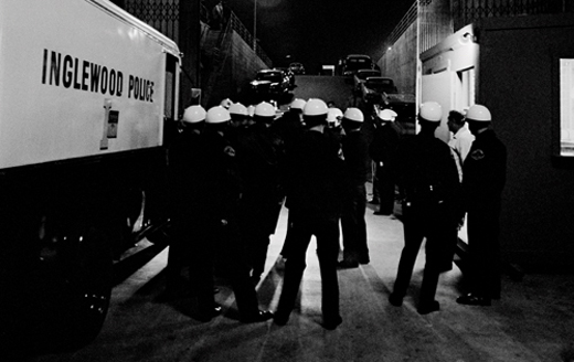 Banned from being in front of the stage the LAPD huddles together at an - photo 2