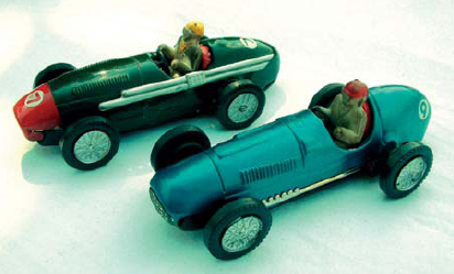 The first two tinplate cars with their hand-less rubber drivers the Ferrari in - photo 8