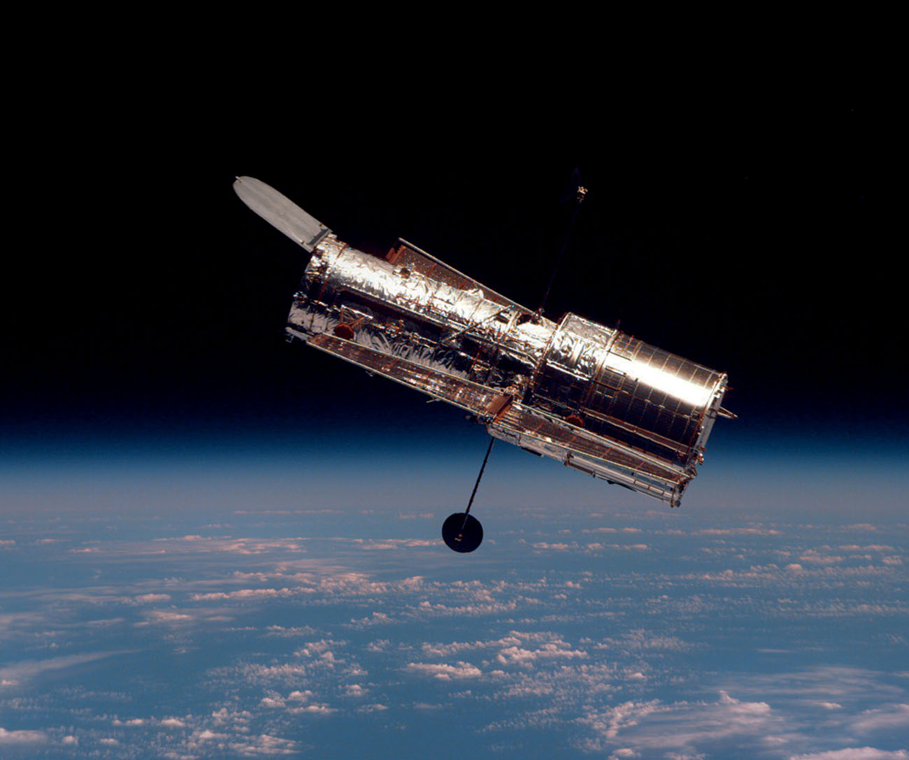 The Hubble Space Telescope is about as long as a school bus How does the - photo 8